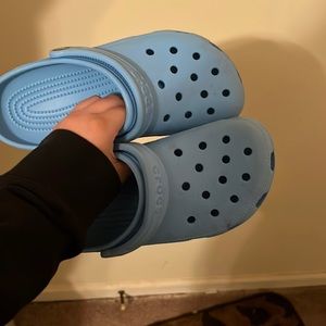 I am selling new crocs size 8 in w and 6 m color cute blue worn about 11 times